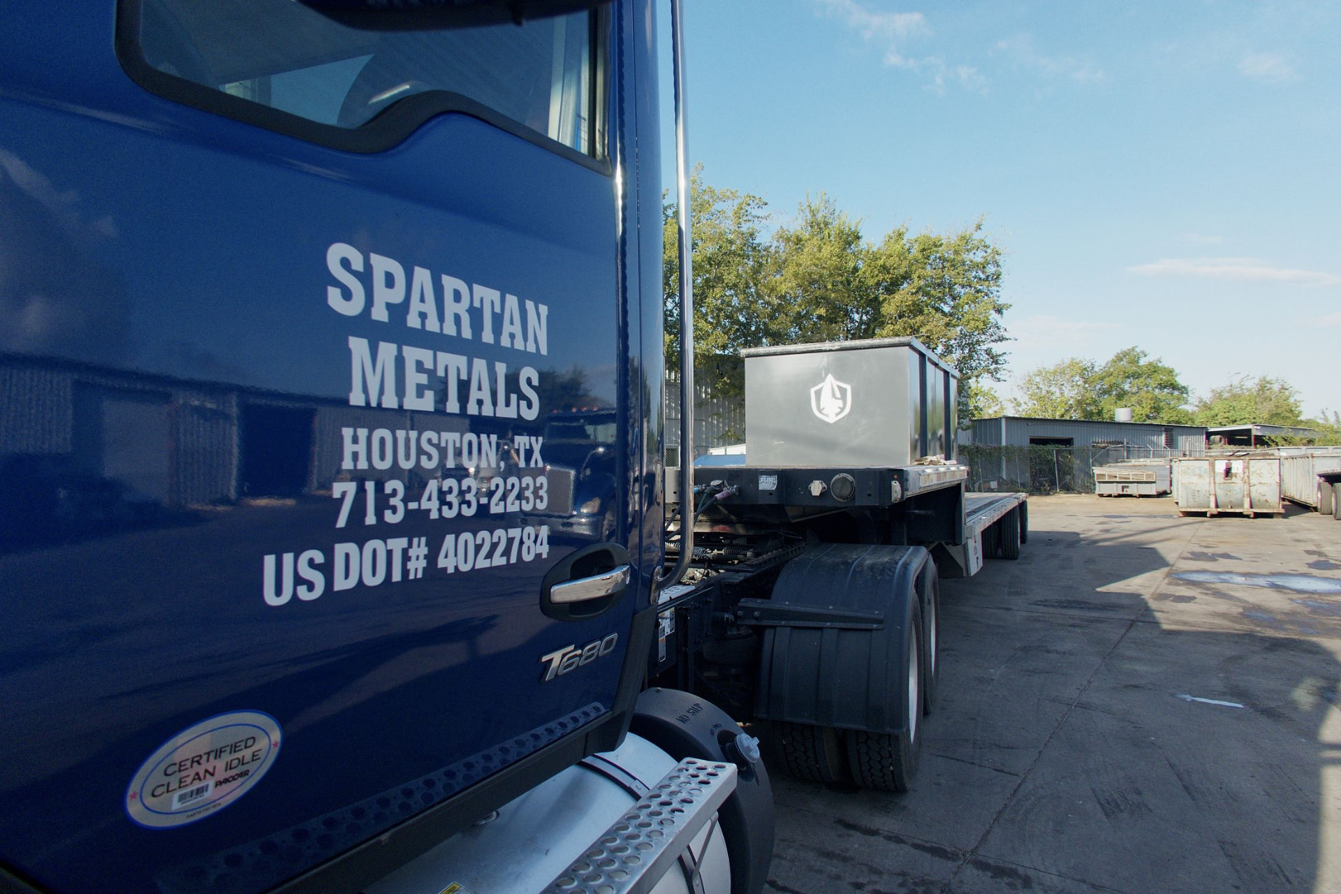 Spartan Metals truck door lettered with the Houston phone number and USDOT number
